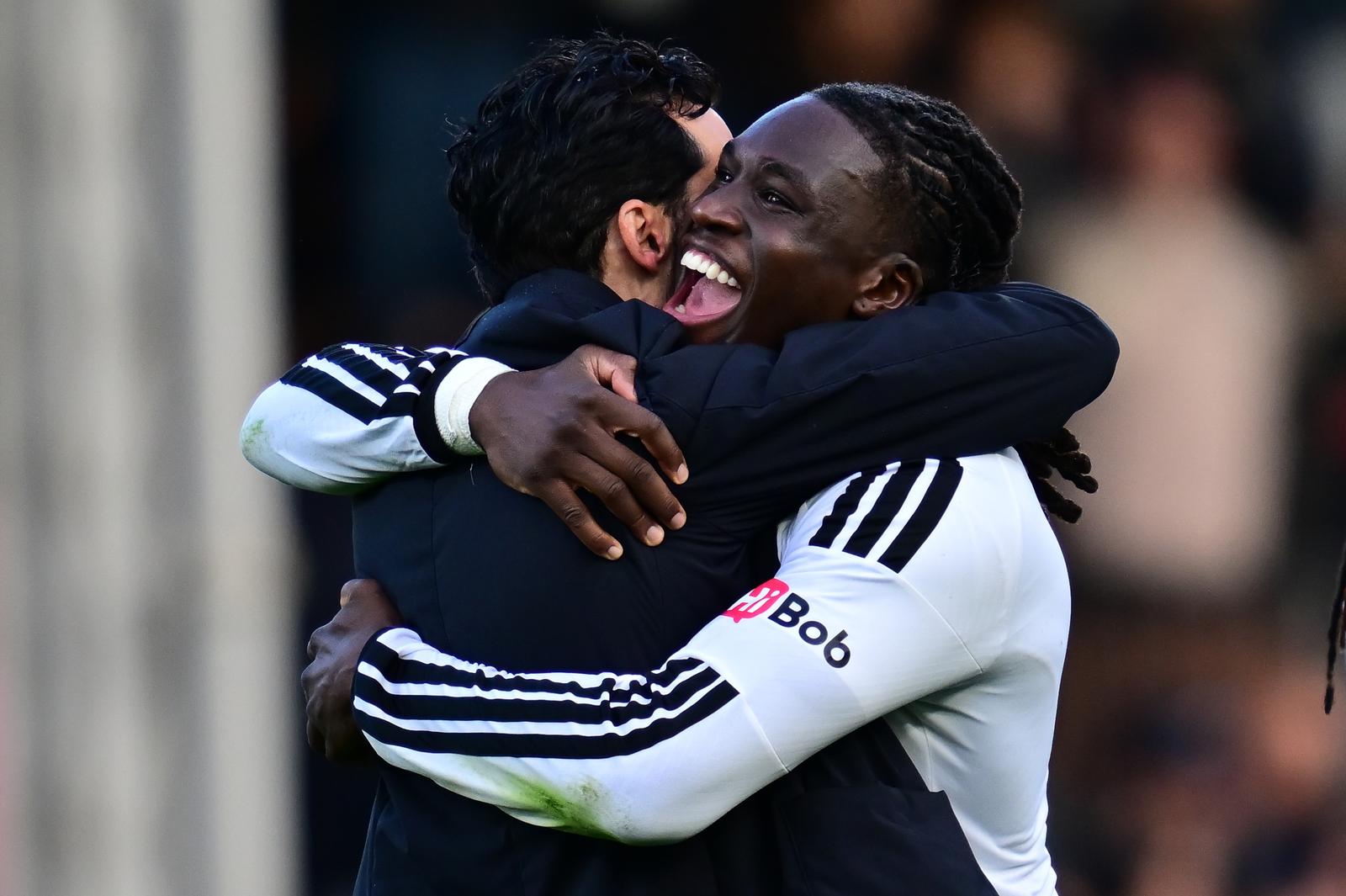 Fulham defender Calvin Bassey (3) hugs Fulham manager Alvaro Arbeloa during the Premier League match between Fulham and Hull City at Craven Cottage, London, UK on 17 October 2026.