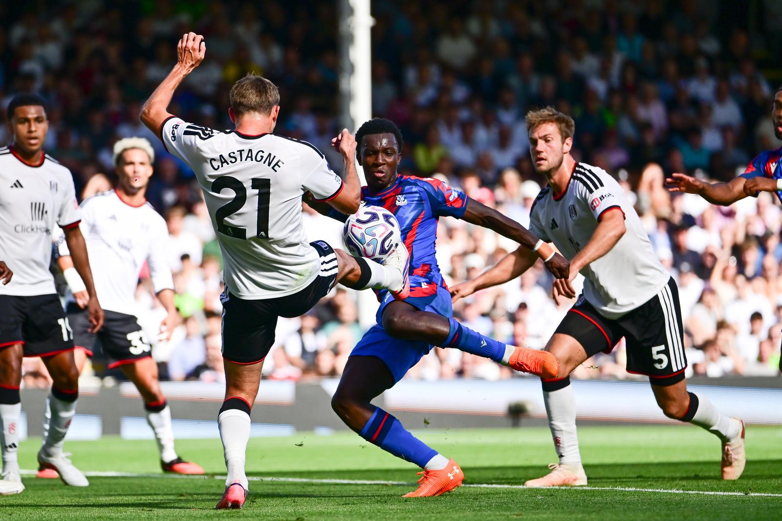 Crystal Palace forward Eddie Nketiah (9) takes a shot at goal under pressure from Fulham defender Timothy Castagne (21) during the Premier League match between Fulham and Crystal Palace at Craven Cottage, London, UK on 5 September 2026.