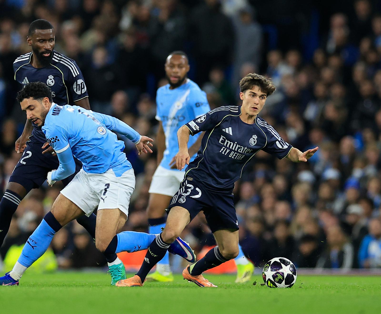 Manuel Angel (37) of Real Madrid wins the ball from Omar Marmoush (7) of Manchester City during the Champions League match between Manchester City and Real Madrid at the Etihad Stadium, Manchester, UK on 17 March 2026.